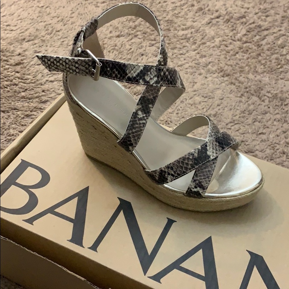 Never worn trendy snake skin espadrille wedges.